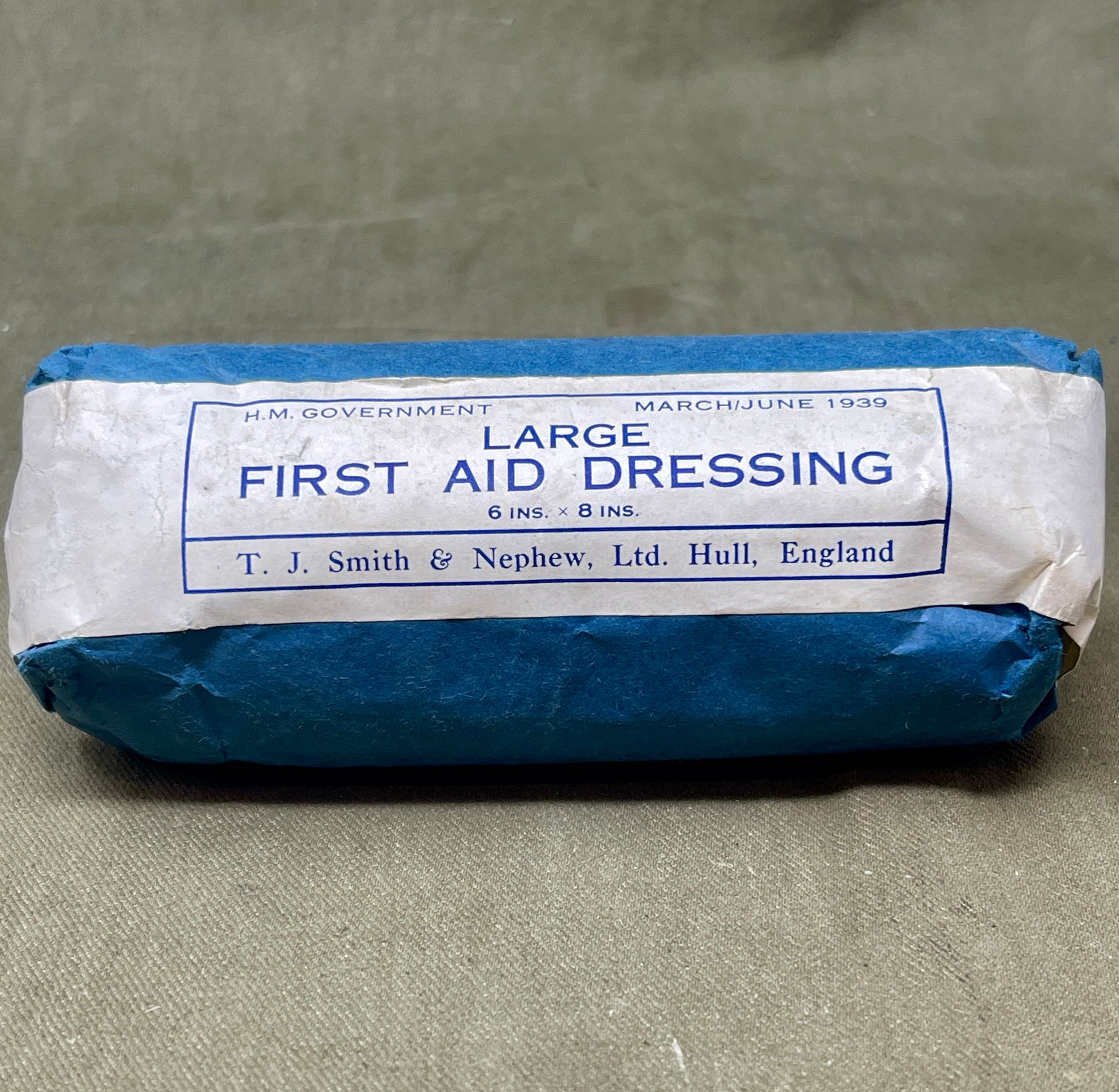 This Large First Aid Dressing, manufactured by T.J. Smith & Nephew Ltd in Hull, England, is a vintage medical supply that highlights the craftsmanship and practical design of mid-20th-century healthcare essentials. Known for its reliability and quality, Smith & Nephew was a renowned manufacturer of medical and surgical products, and this dressing reflects their commitment to excellence.

The dressing is designed for emergency use, providing a sterile and absorbent solution for treating wounds, cuts, or inju