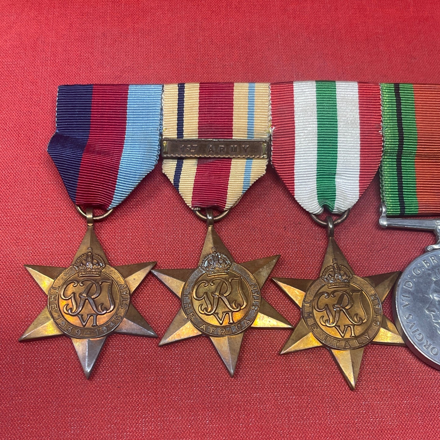 A WWII Medal Group Defence Medal, War Medal, Italy, Africa and 1939-45 Star 