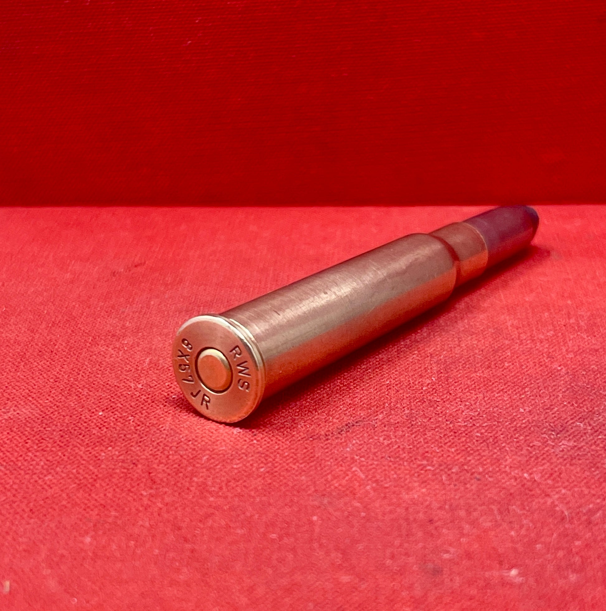 Explore an original RWS 8x57JR inert round, a rare collectible piece of European hunting ammunition history. Perfect for collectors and enthusiasts of vintage cartridges.