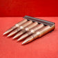 "Discover 5 authentic 7.62x54mm Russian inert cartridges on a classic stripper clip. Perfect for collectors and enthusiasts, these safe, deactivated rounds showcase military history."