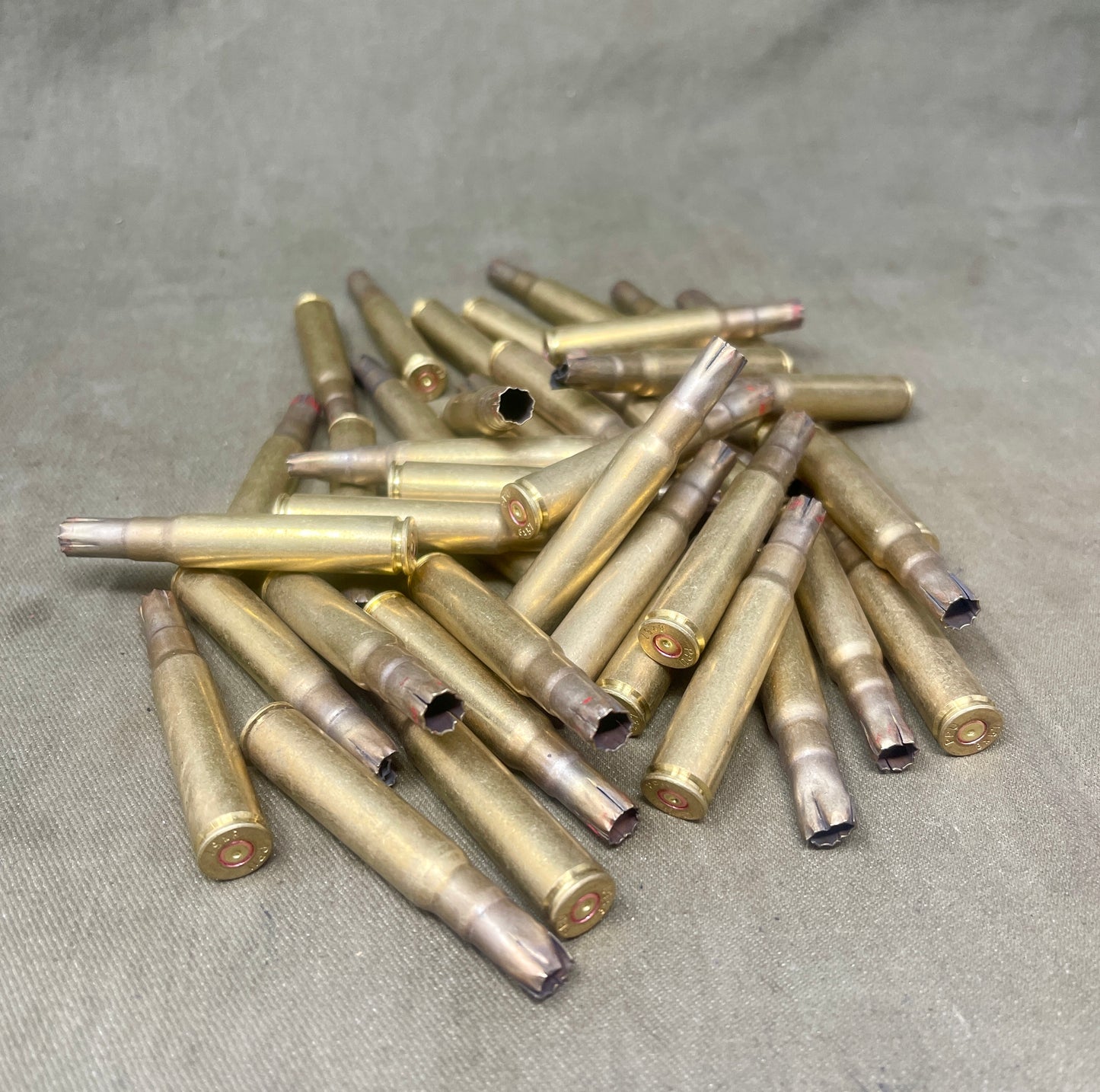 "Explore 50 x 7.92x57 8mm fired brass blank cartridge cases, perfect for collectors, reenactors, or historical firearm enthusiasts seeking authentic WWII-era ammunition components."