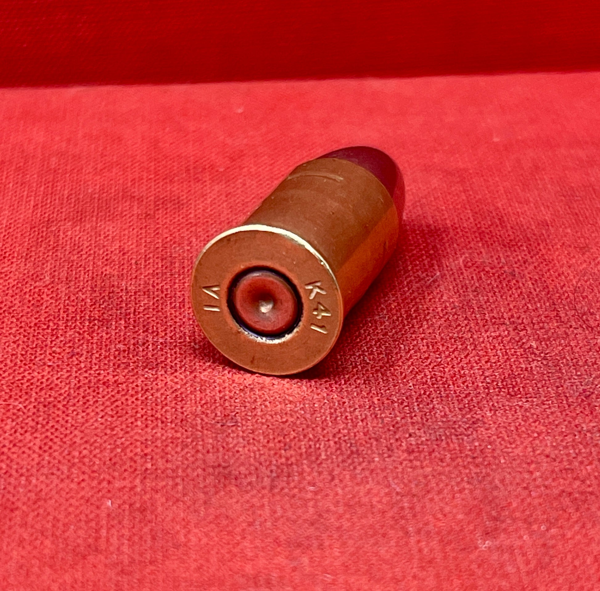 Collectible .455 INERT British 1941 K round by Kynoch. WWII-era deactivated ammunition, perfect for display and collectors of military history.