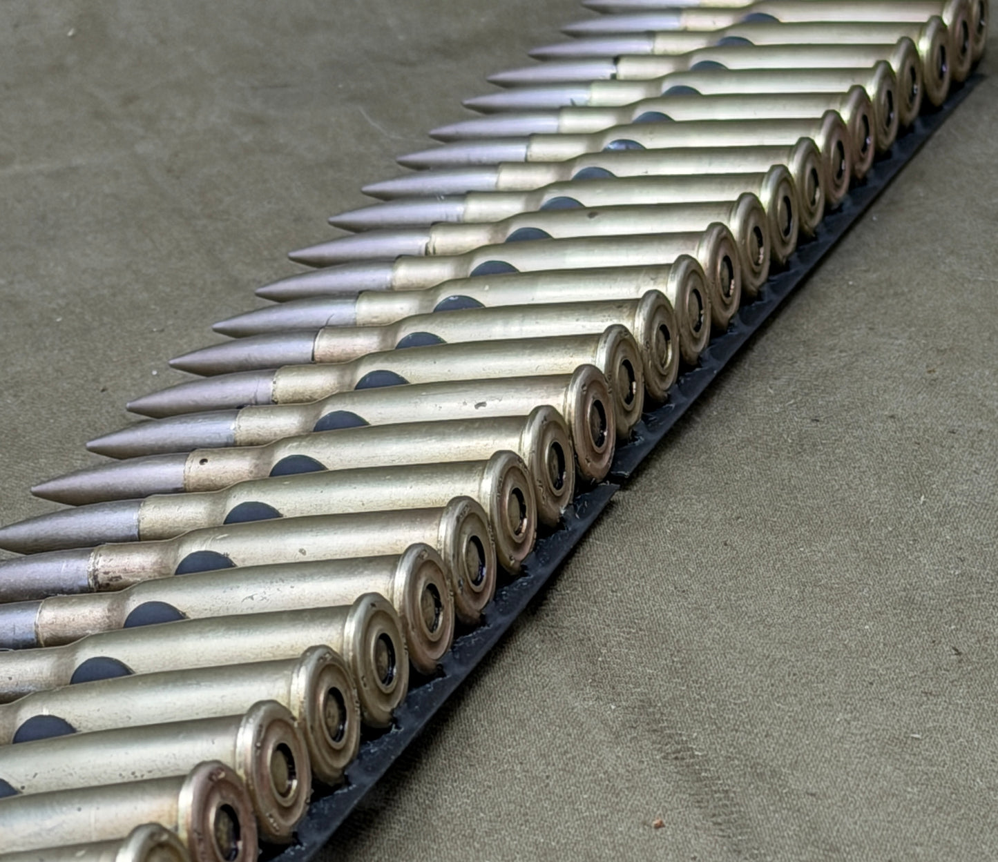 30 × Inert French 8×50mmR Lebel 1948 Rounds on Original 30-Round Hotchkiss Strip – Oil Injected Display Set