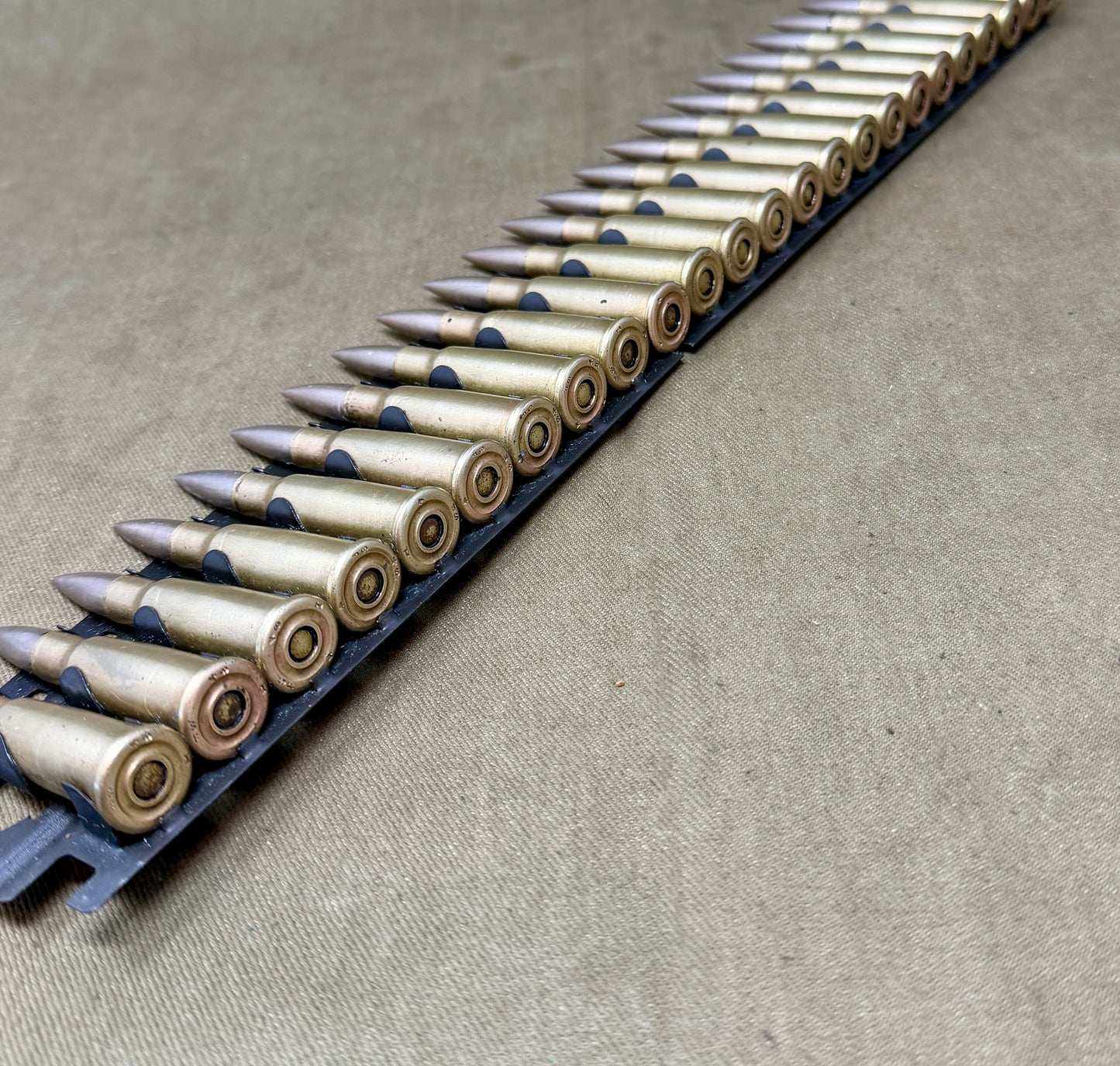 30 × Inert French 8×50mmR Lebel 1948 Rounds on Original 30-Round Hotchkiss Strip – Oil Injected Display Set