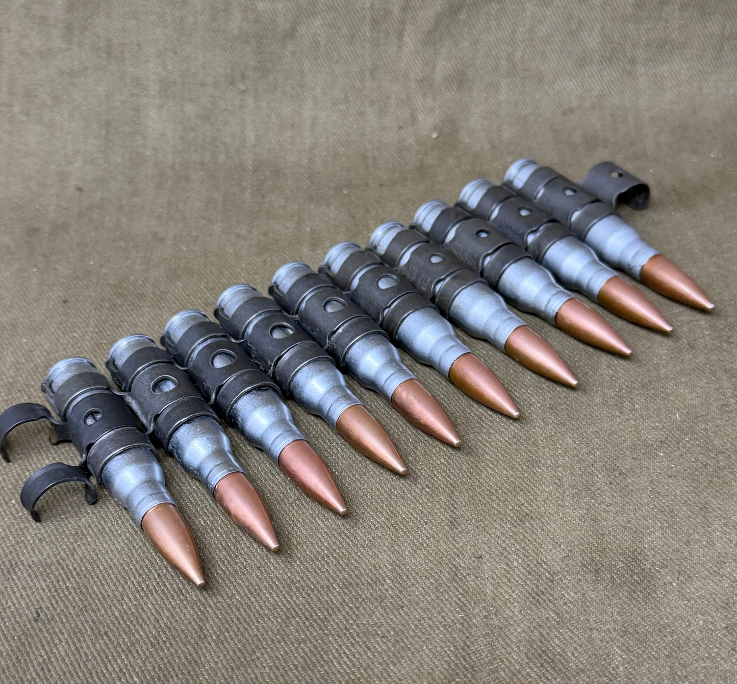10 x 7.62mm British Military Drill Rounds in Original GPMG Link Belt – Inert Display Set