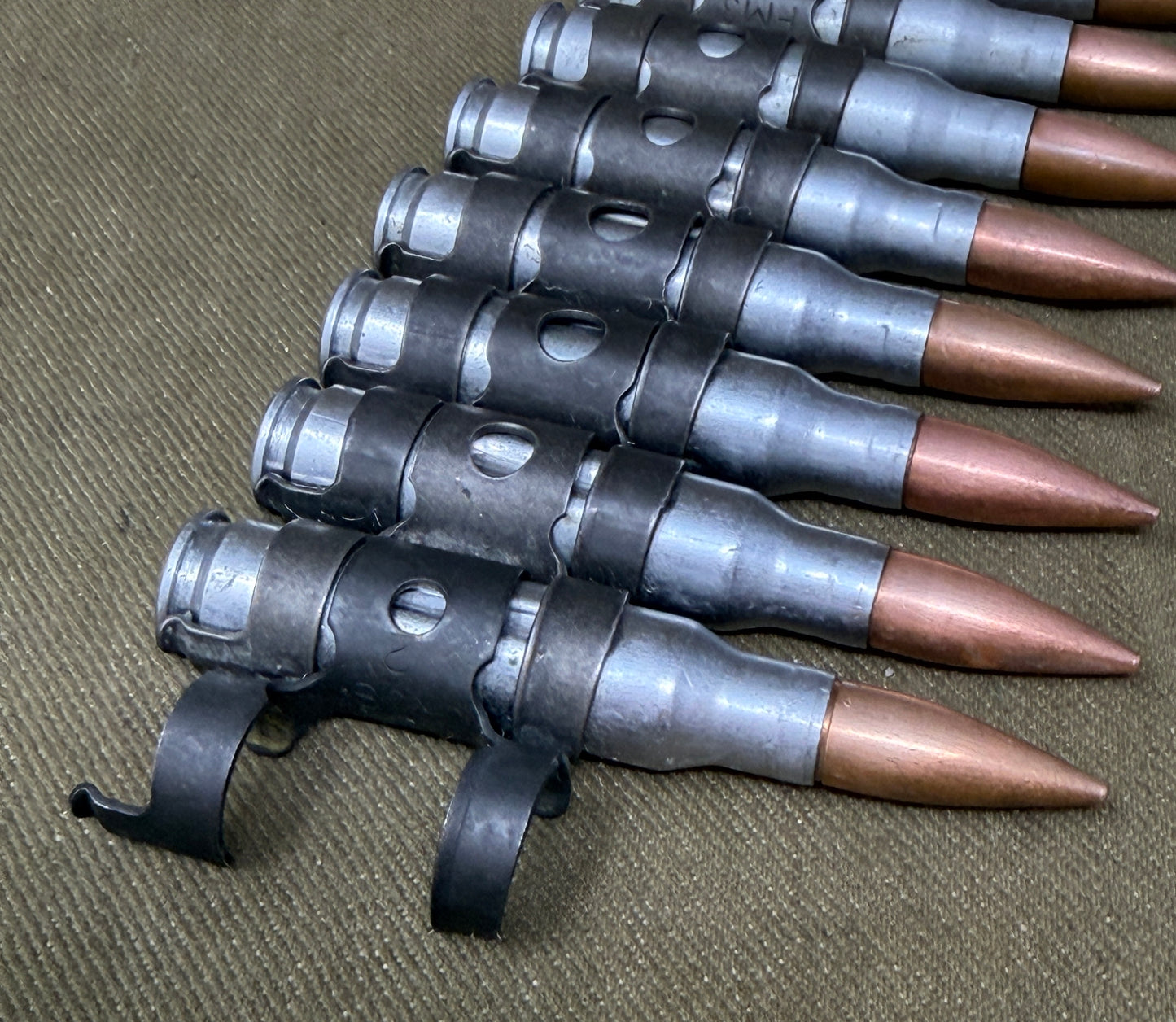10 x 7.62mm British Military Drill Rounds in Original GPMG Link Belt – Inert Display Set