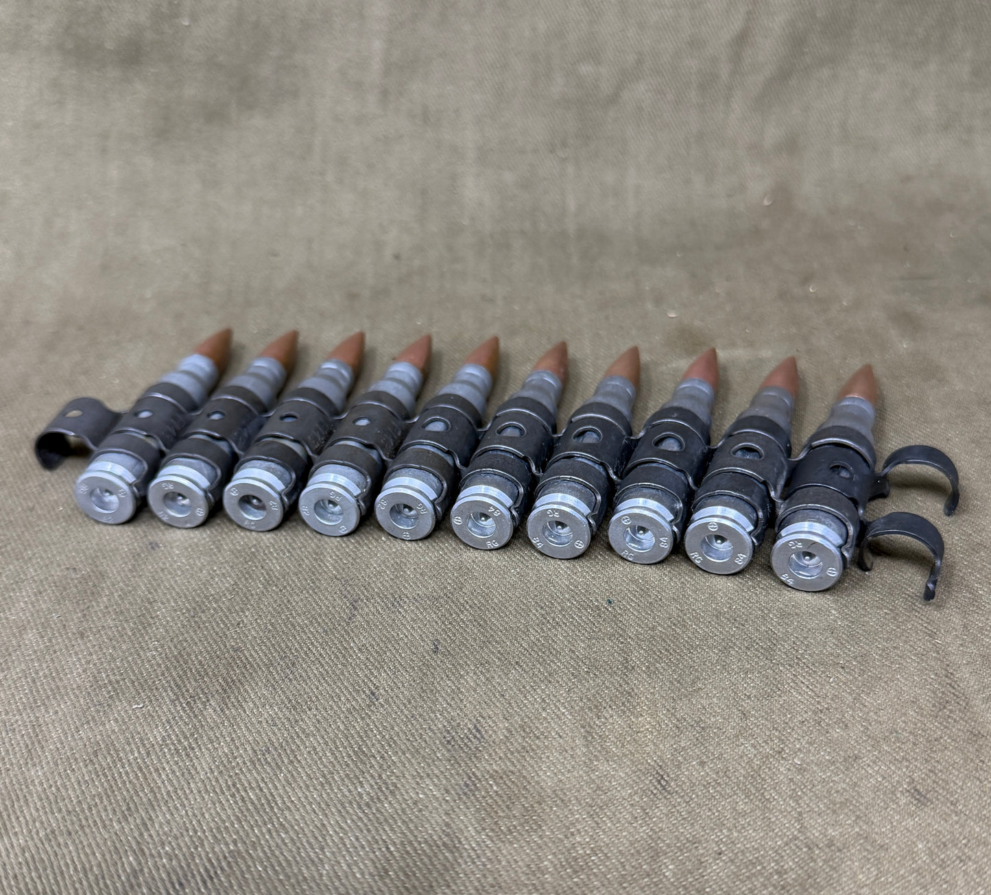 10 x 7.62mm British Military Drill Rounds in Original GPMG Link Belt – Inert Display Set