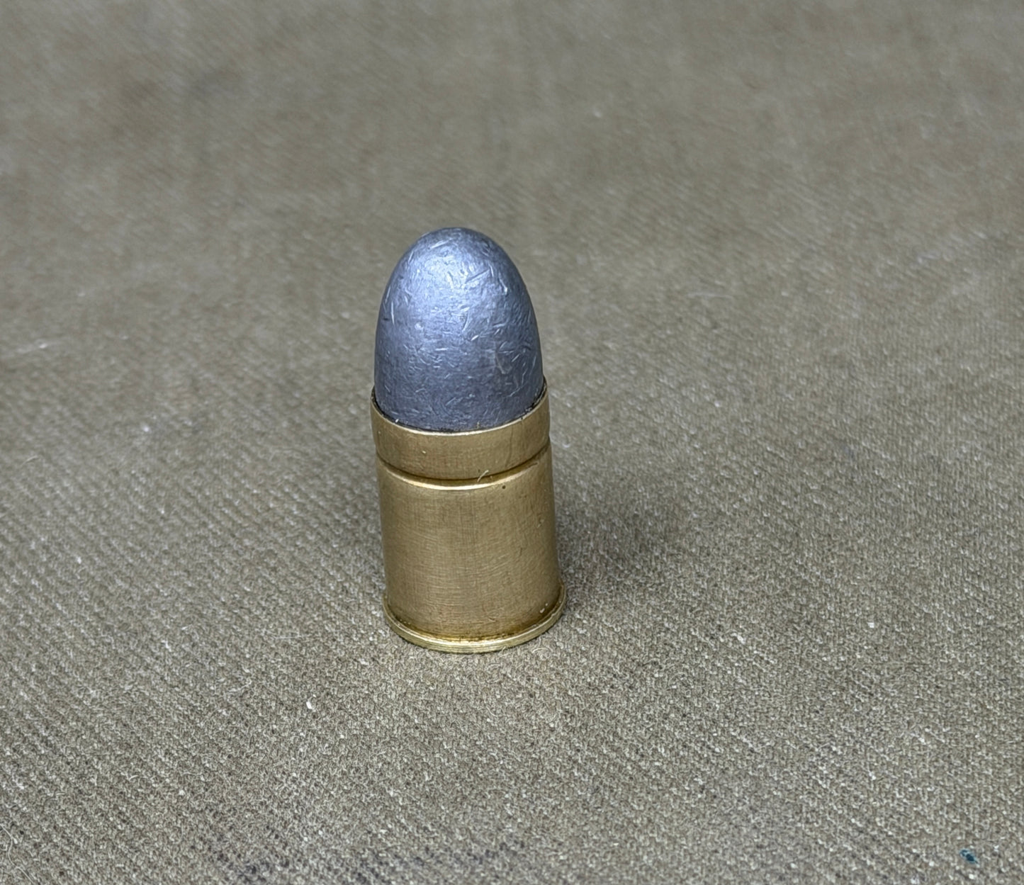 An original .450 calibre Kynoch inert brass cartridge