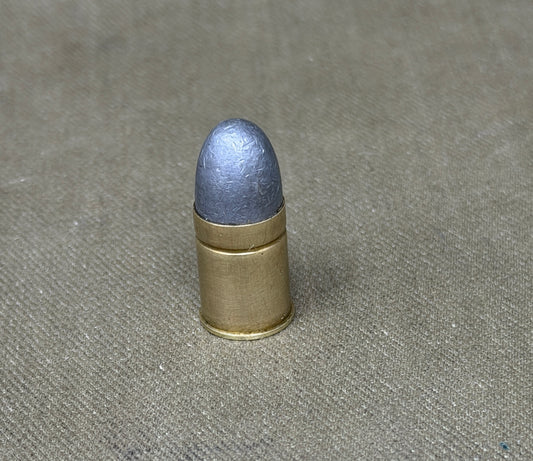 An original .450 calibre Kynoch inert brass cartridge