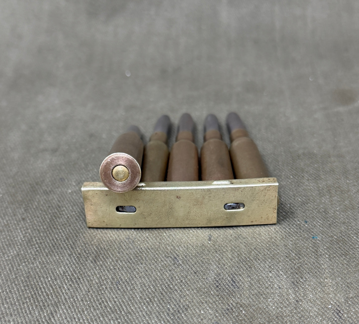 Original Japanese Type 38 Arisaka 6.5mm Inert Rounds on Charger Clip – WW2 / Pre-WW2