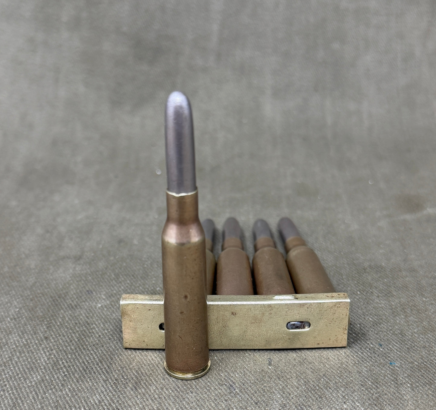 Original Japanese Type 38 Arisaka 6.5mm Inert Rounds on Charger Clip – WW2 / Pre-WW2