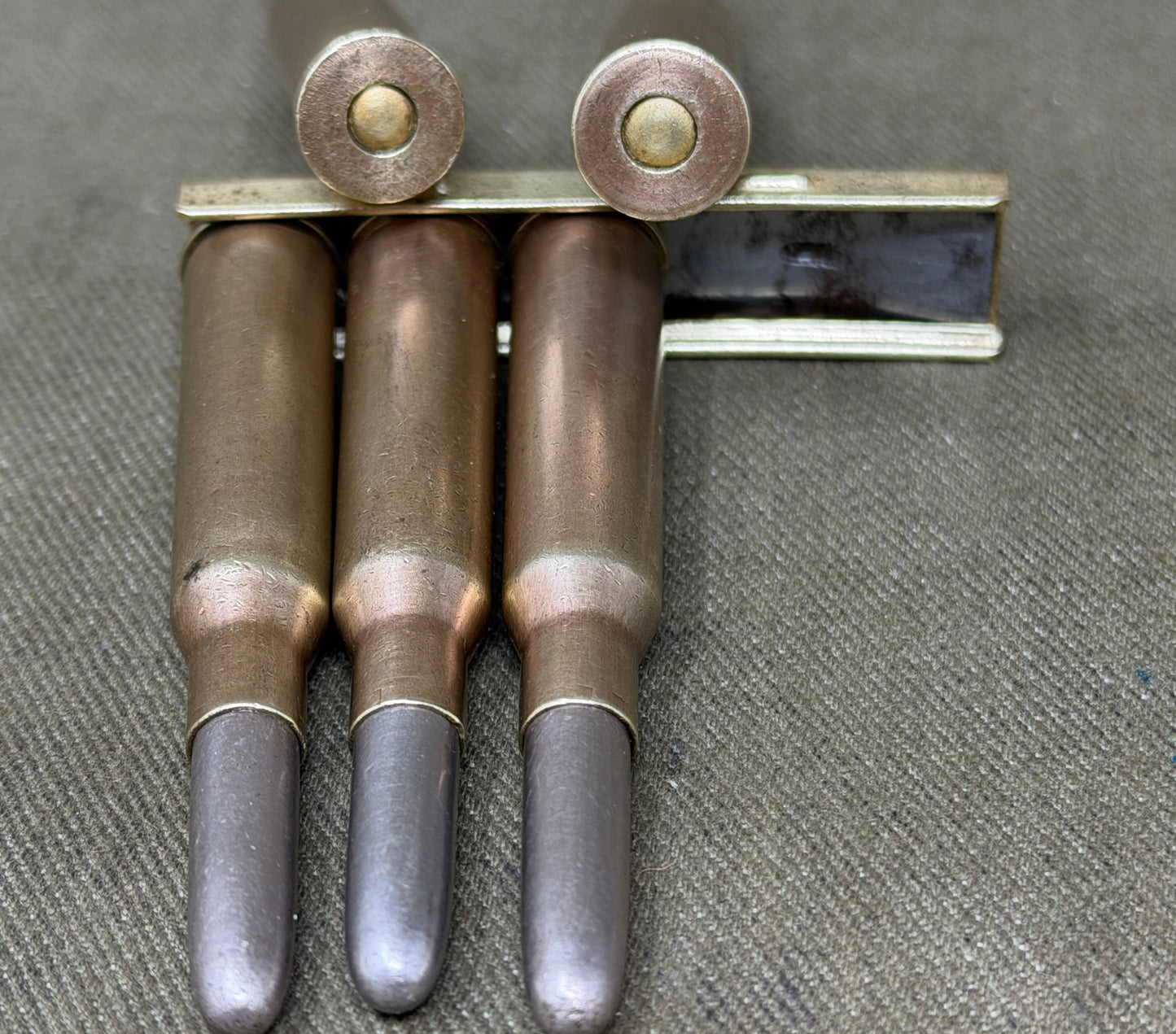 Original Japanese Type 38 Arisaka 6.5mm Inert Rounds on Charger Clip – WW2 / Pre-WW2