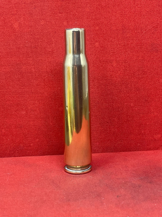 This authentic 1942-dated .50 caliber brass cartridge case, manufactured by Frankford Arsenal (F A) in the USA, is a significant relic from World War II. Originally designed for use in the powerful M2 Browning machine gun, this cartridge case played a crucial role in air, land, and naval combat.

Stamped with the "F A 42" headstamp, this case provides a direct connection to America’s wartime ammunition production, showcasing the craftsmanship and engineering that supported the Allied war effort. The .50 BMG