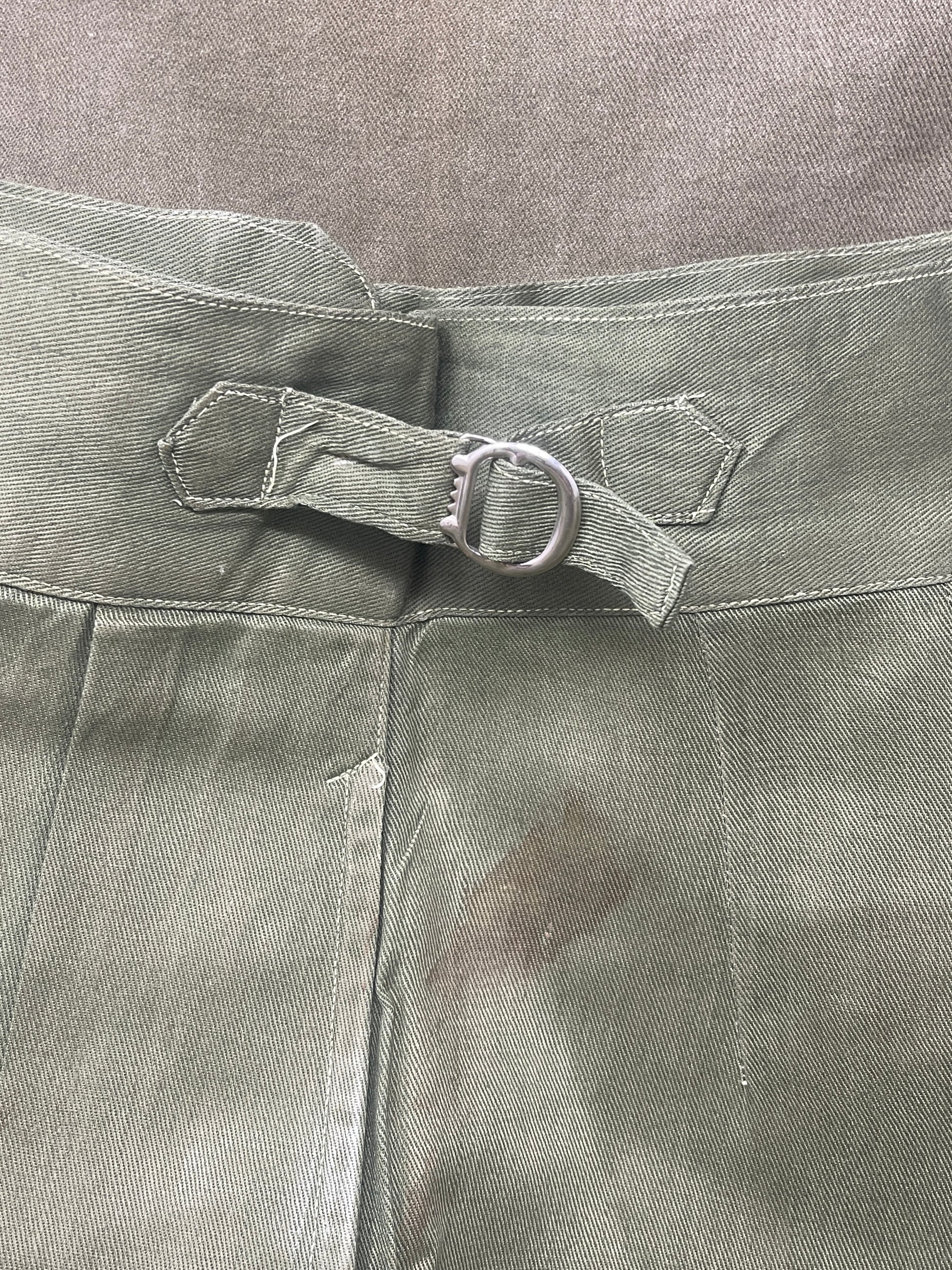 Original 1950s British Army Jungle Green shorts, locally made, Size 3 (30"-31" waist). Excellent condition with classic military design—ideal for collectors or re-enactors.