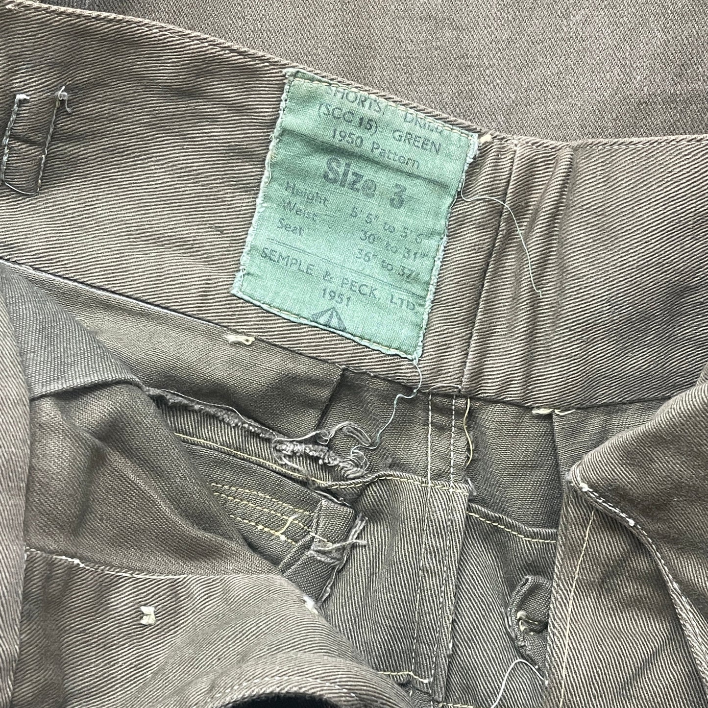 Original 1950s British Army Jungle Green shorts, locally made, Size 3 (30"-31" waist). Excellent condition with classic military design—ideal for collectors or re-enactors.