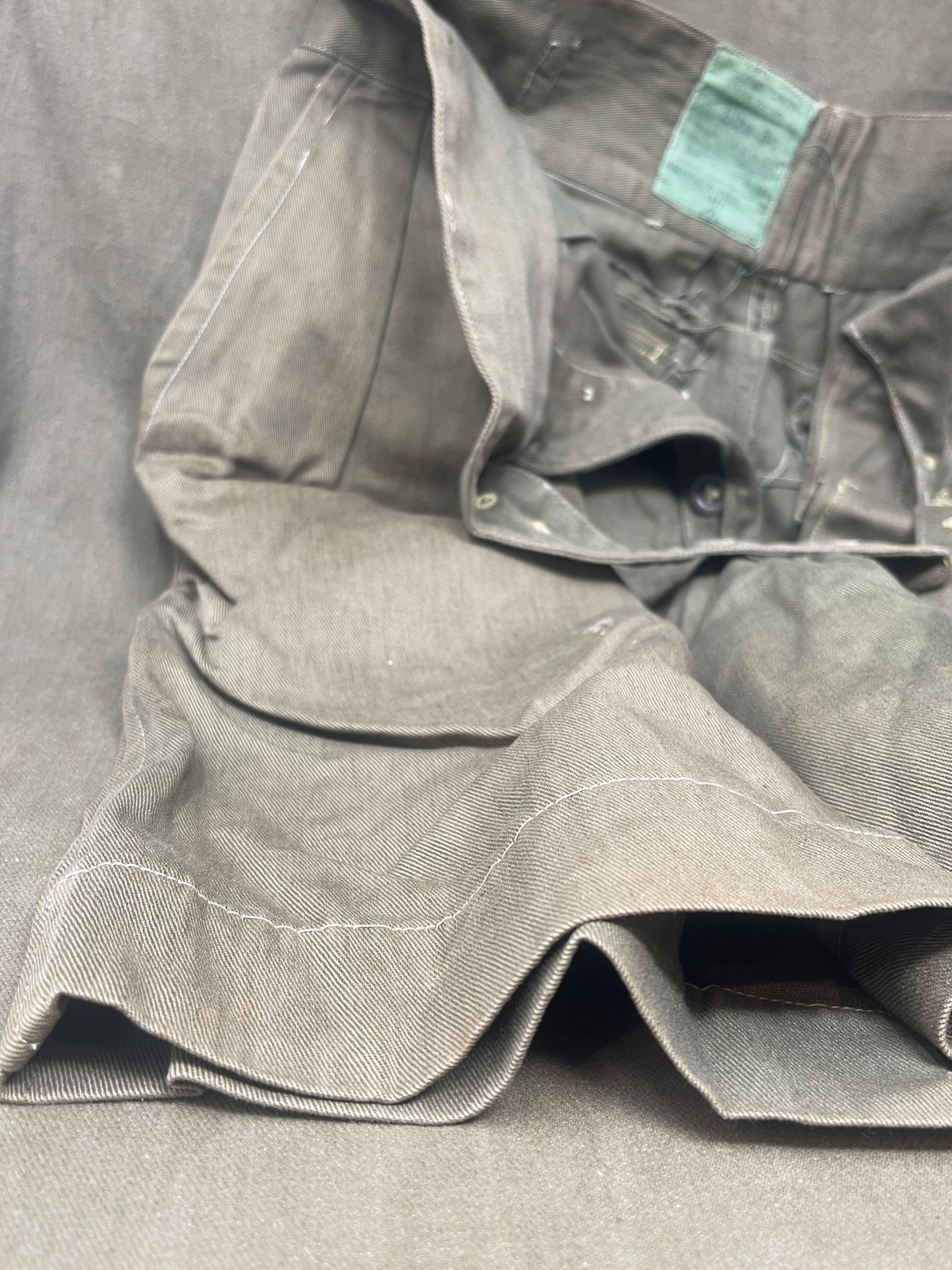 Original 1950s British Army Jungle Green shorts, locally made, Size 3 (30"-31" waist). Excellent condition with classic military design—ideal for collectors or re-enactors.