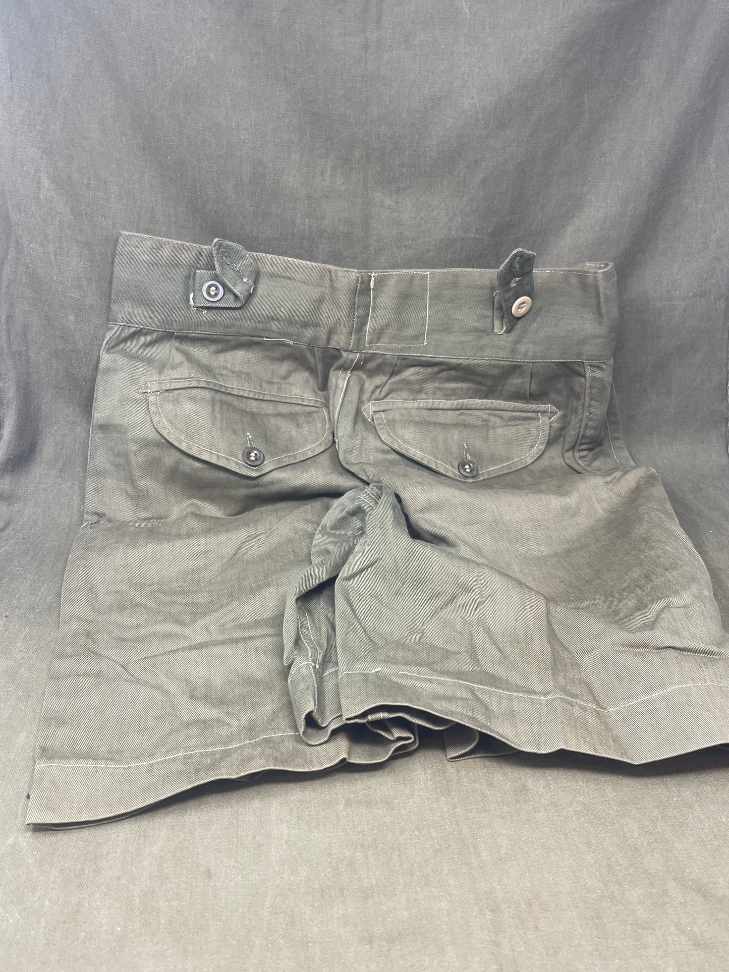 Original 1950s British Army Jungle Green shorts, locally made, Size 3 (30"-31" waist). Excellent condition with classic military design—ideal for collectors or re-enactors.