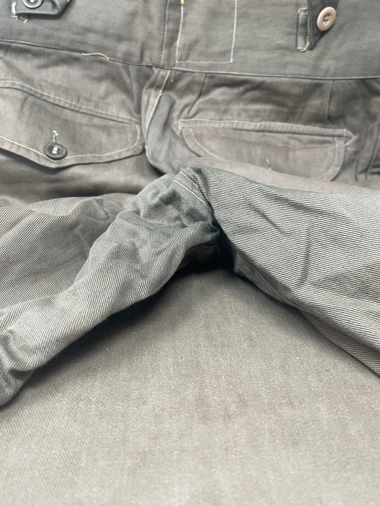 Original 1950s British Army Jungle Green shorts, locally made, Size 3 (30"-31" waist). Excellent condition with classic military design—ideal for collectors or re-enactors.