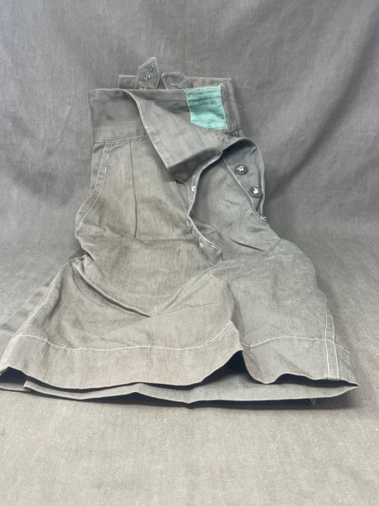 Original 1950s British Army Jungle Green shorts, locally made, Size 3 (30"-31" waist). Excellent condition with classic military design—ideal for collectors or re-enactors.