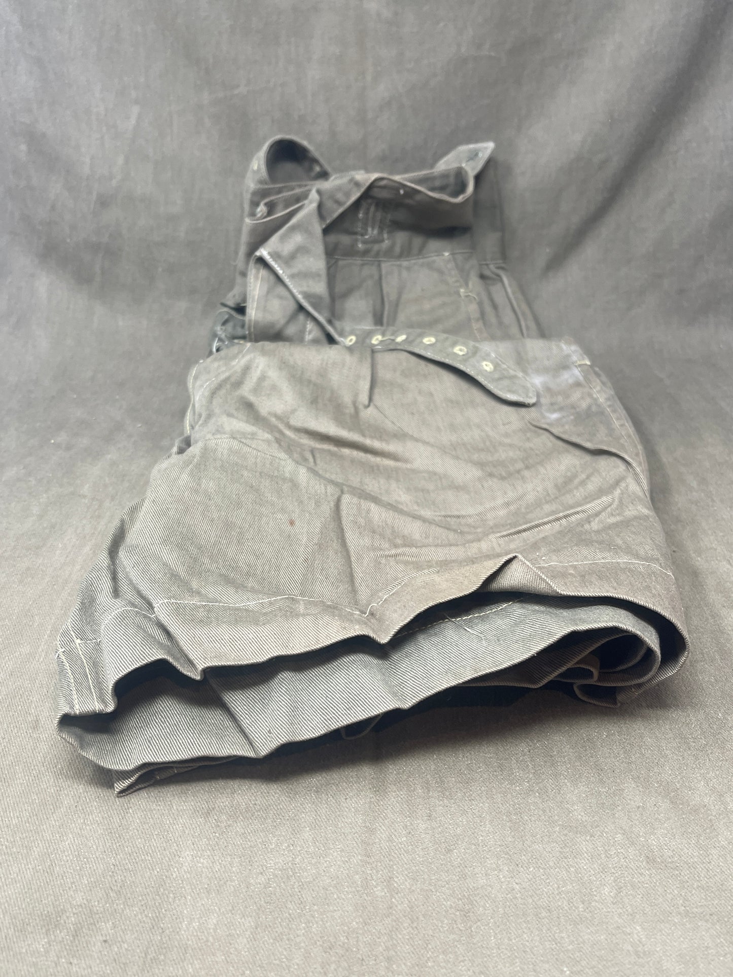 Original 1950s British Army Jungle Green shorts, locally made, Size 3 (30"-31" waist). Excellent condition with classic military design—ideal for collectors or re-enactors.