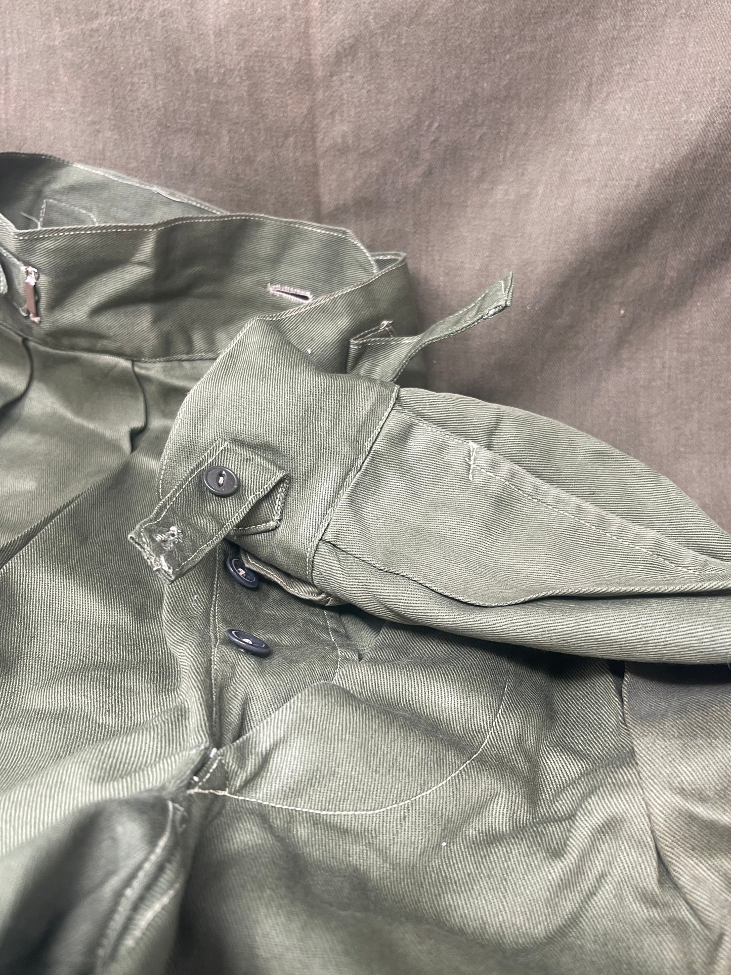Original 1950s British Army Jungle Green shorts, locally made, Size 3 (30"-31" waist). Excellent condition with classic military design—ideal for collectors or re-enactors.