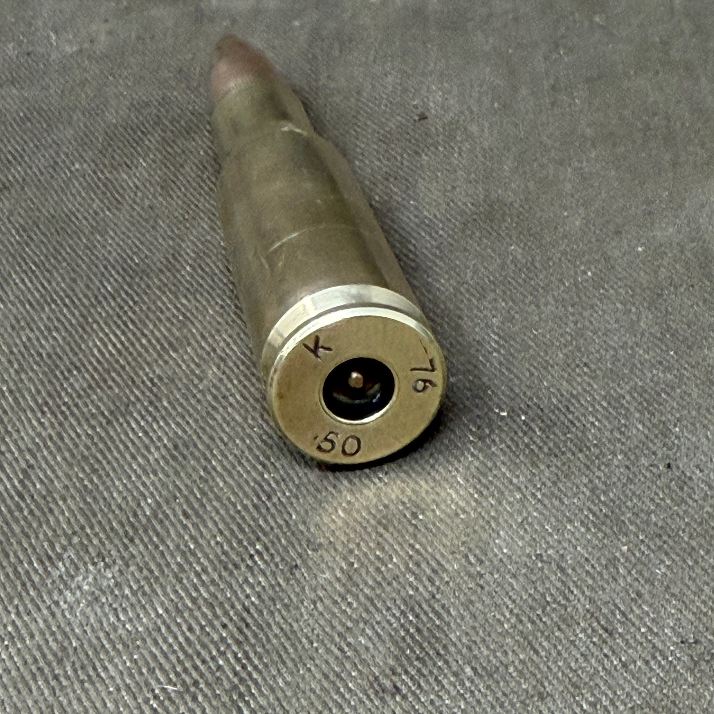 An Inert British .50 Cal Spotter round for 120mm Wombat
