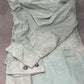 This original 1951-dated British Army Jungle Green Bush Jacket is a superb example of early post-war tropical combat clothing, manufactured by the reputable N. Lotery & Co. Ltd. Made from sturdy, breathable cotton in classic Jungle Green, this jacket was designed for use in humid and challenging environments such as Malaya and other post-war theatres of operation.

The jacket is in excellent condition, showing minimal signs of wear, with its color, stitching, and structural integrity all remarkably well-pre