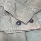 This original 1951-dated British Army Jungle Green Bush Jacket is a superb example of early post-war tropical combat clothing, manufactured by the reputable N. Lotery & Co. Ltd. Made from sturdy, breathable cotton in classic Jungle Green, this jacket was designed for use in humid and challenging environments such as Malaya and other post-war theatres of operation.

The jacket is in excellent condition, showing minimal signs of wear, with its color, stitching, and structural integrity all remarkably well-pre
