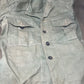 This original 1951-dated British Army Jungle Green Bush Jacket is a superb example of early post-war tropical combat clothing, manufactured by the reputable N. Lotery & Co. Ltd. Made from sturdy, breathable cotton in classic Jungle Green, this jacket was designed for use in humid and challenging environments such as Malaya and other post-war theatres of operation.

The jacket is in excellent condition, showing minimal signs of wear, with its color, stitching, and structural integrity all remarkably well-pre