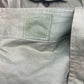 This original 1951-dated British Army Jungle Green Bush Jacket is a superb example of early post-war tropical combat clothing, manufactured by the reputable N. Lotery & Co. Ltd. Made from sturdy, breathable cotton in classic Jungle Green, this jacket was designed for use in humid and challenging environments such as Malaya and other post-war theatres of operation.

The jacket is in excellent condition, showing minimal signs of wear, with its color, stitching, and structural integrity all remarkably well-pre