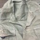 This original 1951-dated British Army Jungle Green Bush Jacket is a superb example of early post-war tropical combat clothing, manufactured by the reputable N. Lotery & Co. Ltd. Made from sturdy, breathable cotton in classic Jungle Green, this jacket was designed for use in humid and challenging environments such as Malaya and other post-war theatres of operation.

The jacket is in excellent condition, showing minimal signs of wear, with its color, stitching, and structural integrity all remarkably well-pre