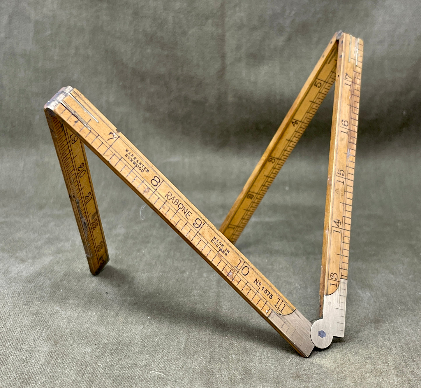 Shop the 1939-dated Rabone No.1375 Boxwood Yard Ruler. A rare, warranted folding ruler made in England—perfect for collectors, woodworkers, and vintage tool lovers.