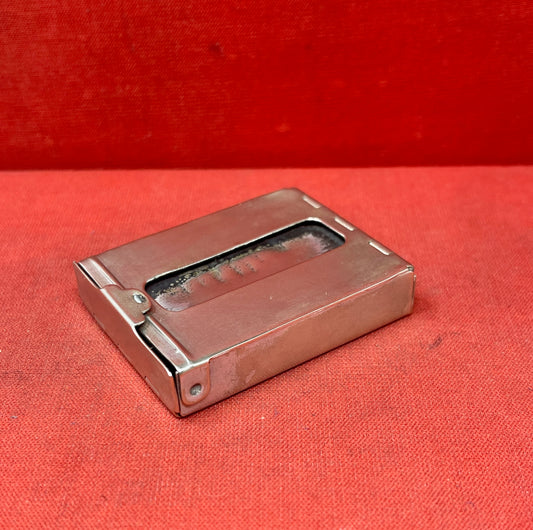 Add a touch of vintage charm to your collection with this original British brass hinged match holder, dating to the 1920s. Crafted from solid brass with a warm aged patina, it features a hinged lid and internal compartment designed to keep matches dry and ready for use. Compact and practical, it would have been a common pocket or travel item in the early 20th century. Ideal for collectors of antique smoking accessories, vintage EDC items, or brassware. A beautiful and functional relic from post-WWI Britain,