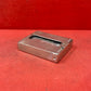 Add a touch of vintage charm to your collection with this original British brass hinged match holder, dating to the 1920s. Crafted from solid brass with a warm aged patina, it features a hinged lid and internal compartment designed to keep matches dry and ready for use. Compact and practical, it would have been a common pocket or travel item in the early 20th century. Ideal for collectors of antique smoking accessories, vintage EDC items, or brassware. A beautiful and functional relic from post-WWI Britain,