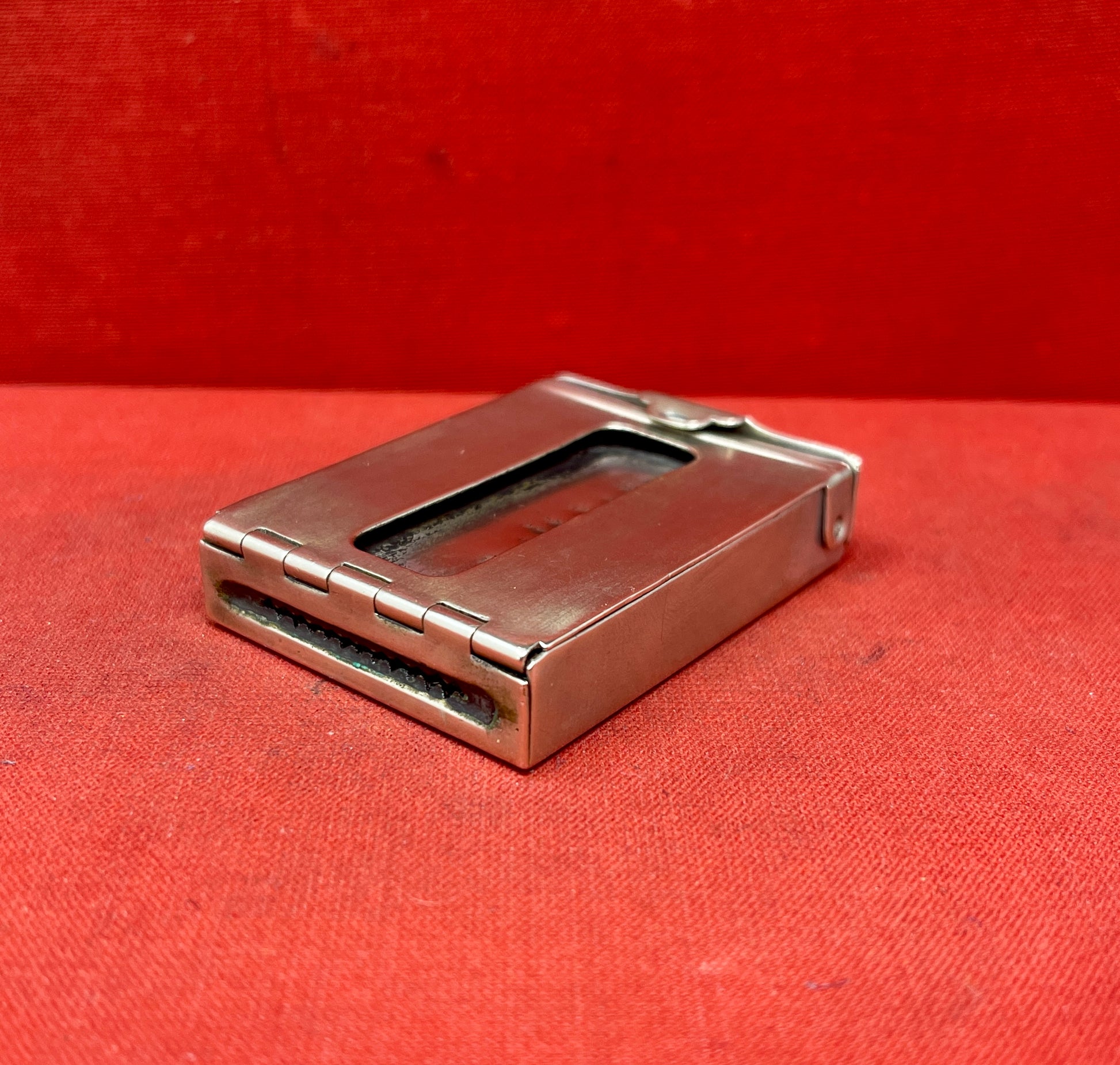 Add a touch of vintage charm to your collection with this original British brass hinged match holder, dating to the 1920s. Crafted from solid brass with a warm aged patina, it features a hinged lid and internal compartment designed to keep matches dry and ready for use. Compact and practical, it would have been a common pocket or travel item in the early 20th century. Ideal for collectors of antique smoking accessories, vintage EDC items, or brassware. A beautiful and functional relic from post-WWI Britain,