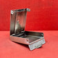 Add a touch of vintage charm to your collection with this original British brass hinged match holder, dating to the 1920s. Crafted from solid brass with a warm aged patina, it features a hinged lid and internal compartment designed to keep matches dry and ready for use. Compact and practical, it would have been a common pocket or travel item in the early 20th century. Ideal for collectors of antique smoking accessories, vintage EDC items, or brassware. A beautiful and functional relic from post-WWI Britain,