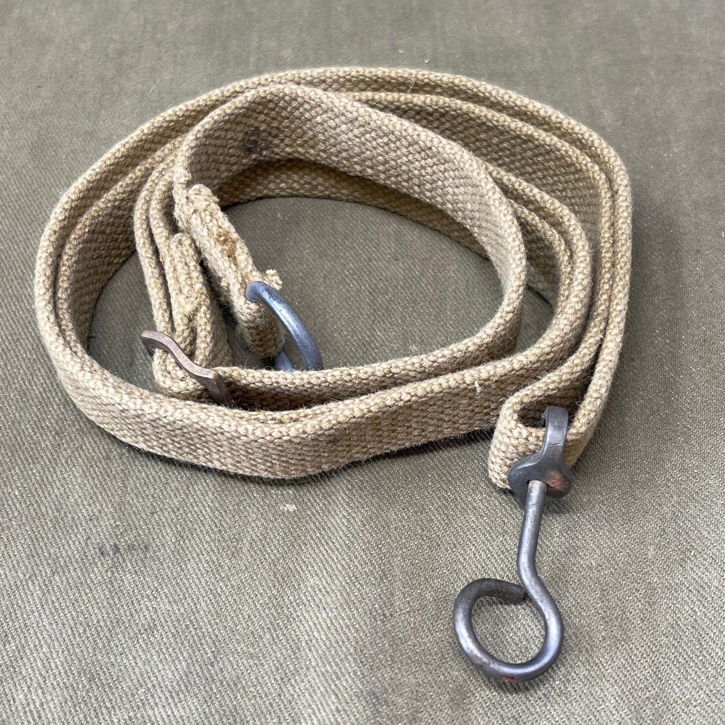 "Authentic British Army WW2 Sten Gun Sling for collectors and reenactors. Durable, adjustable, and historically accurate, perfect for adding a touch of authenticity to your WW2 collection."