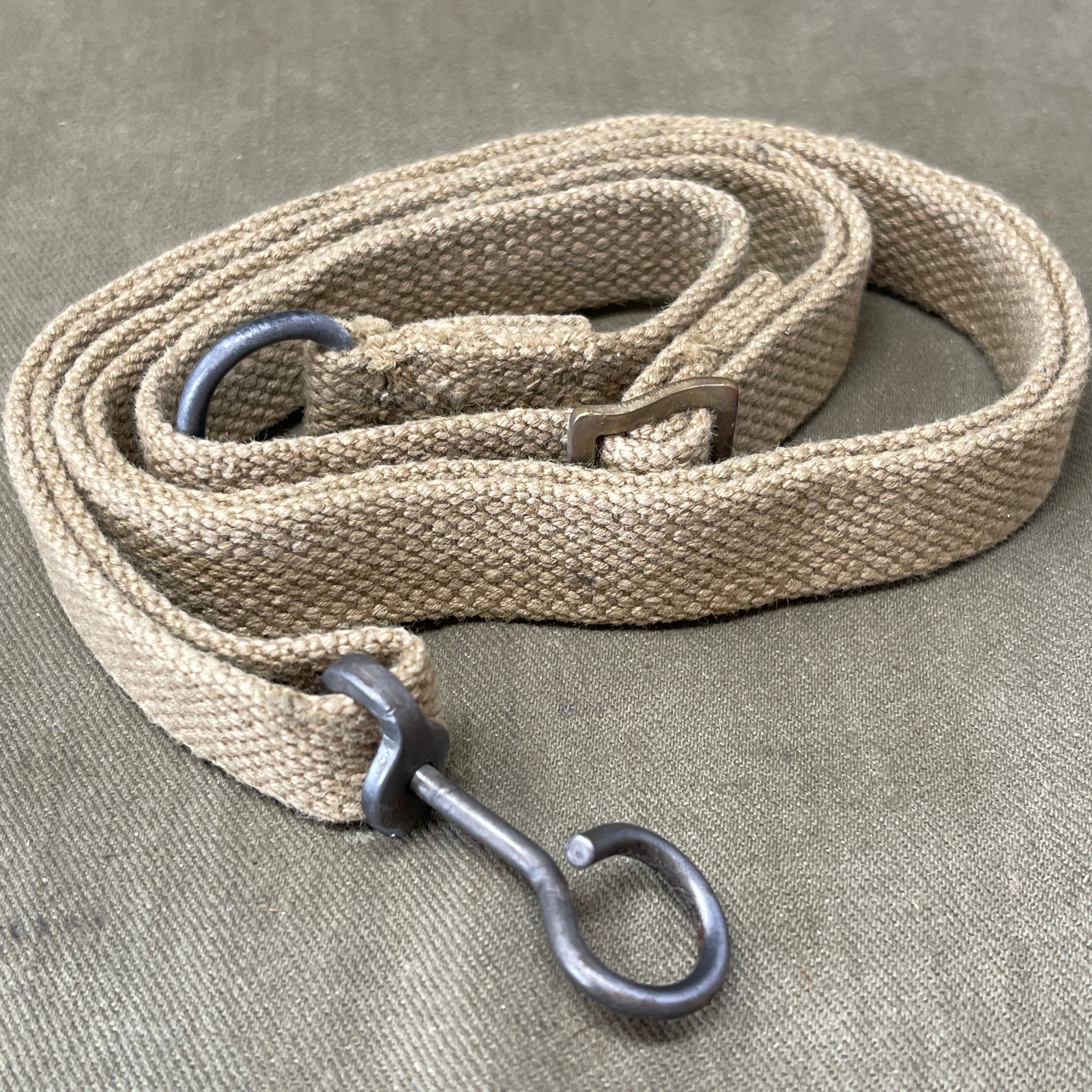 "Authentic British Army WW2 Sten Gun Sling for collectors and reenactors. Durable, adjustable, and historically accurate, perfect for adding a touch of authenticity to your WW2 collection."