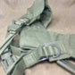 This is an original British Army 1958 Pattern Webbing Yoke, a vital component of the iconic '58 Pattern personal load-carrying system. Issued throughout the Cold War period, this yoke was designed to evenly distribute the weight of webbing pouches and equipment across the shoulders for improved comfort during extended operations.

Constructed from durable olive green webbing, the yoke features adjustable straps, metal fittings, and reinforced stitching for reliable use in the field. It connects securely to 