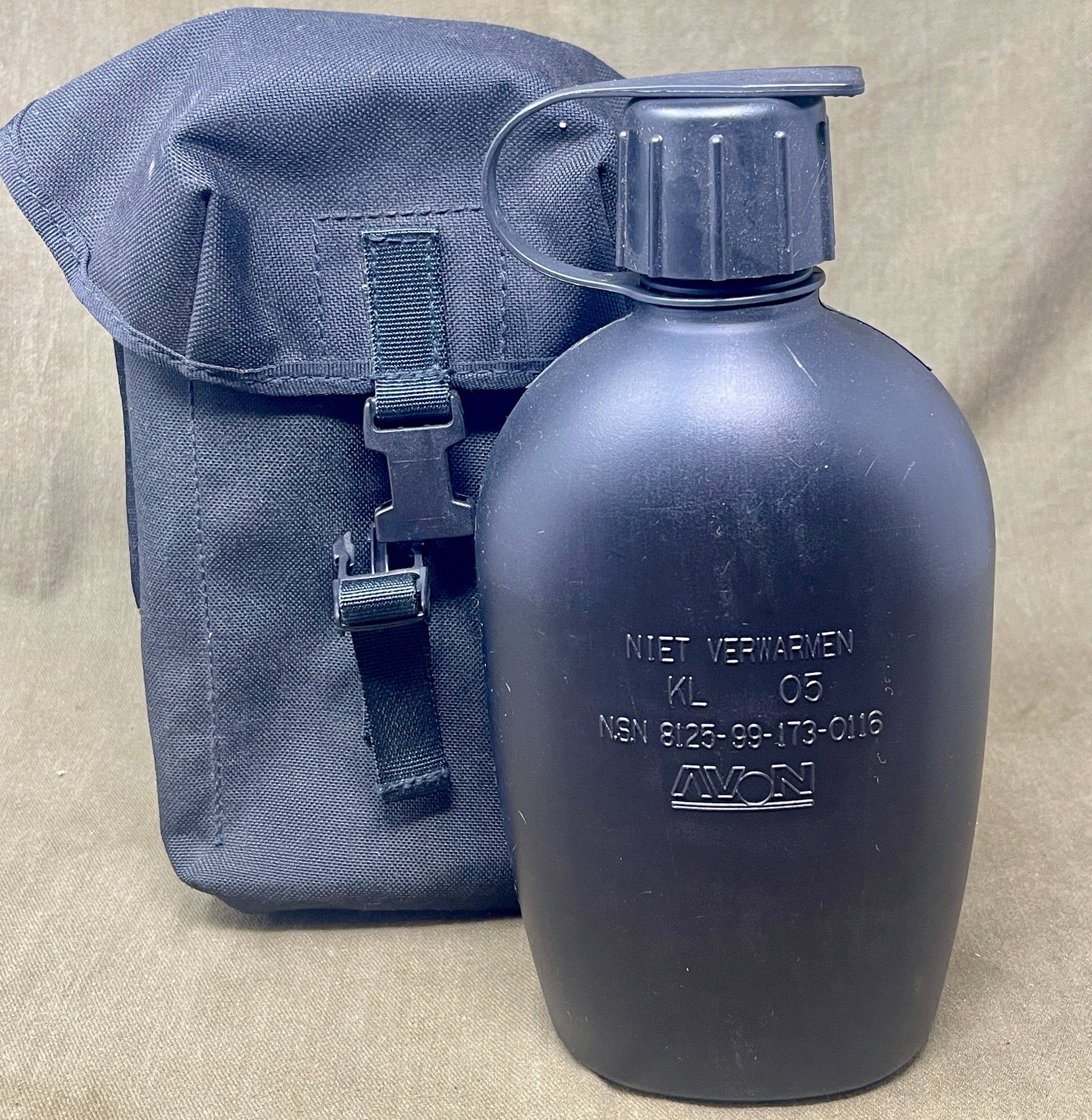 Blue water bottle with carrying strap on a beige background