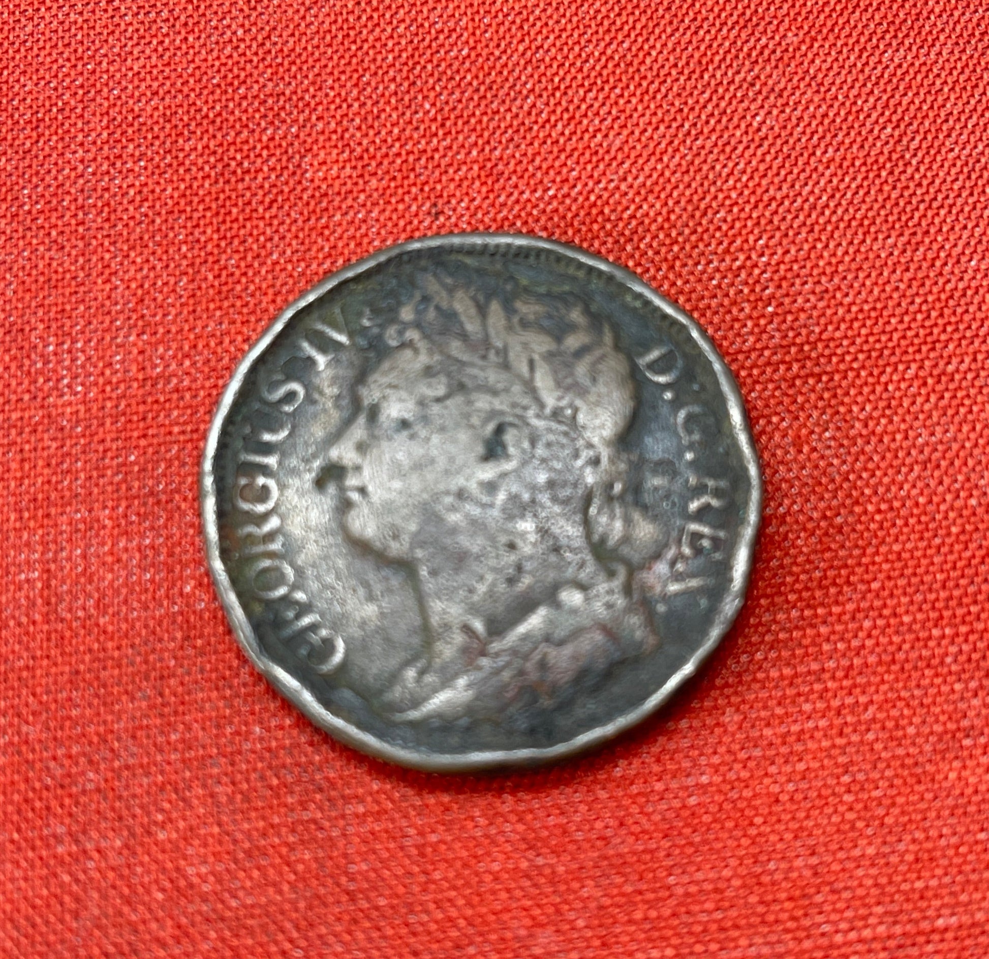 On the obverse side of the coin, you would find the portrait of King George IV. The specific design of the 1826 Farthing featured a bust of the King facing right. King George IV is depicted wearing a laurel wreath around his head, and the inscription "GEORGIUS IIII D.G. BRITANNIAR. REX F.D." can be seen around the portrait, which translates to "George IV, by the Grace of God, King of the Britains, Defender of the Faith."