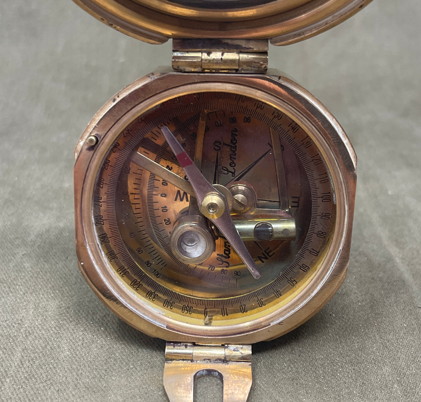Vintage-style compass on a gray background