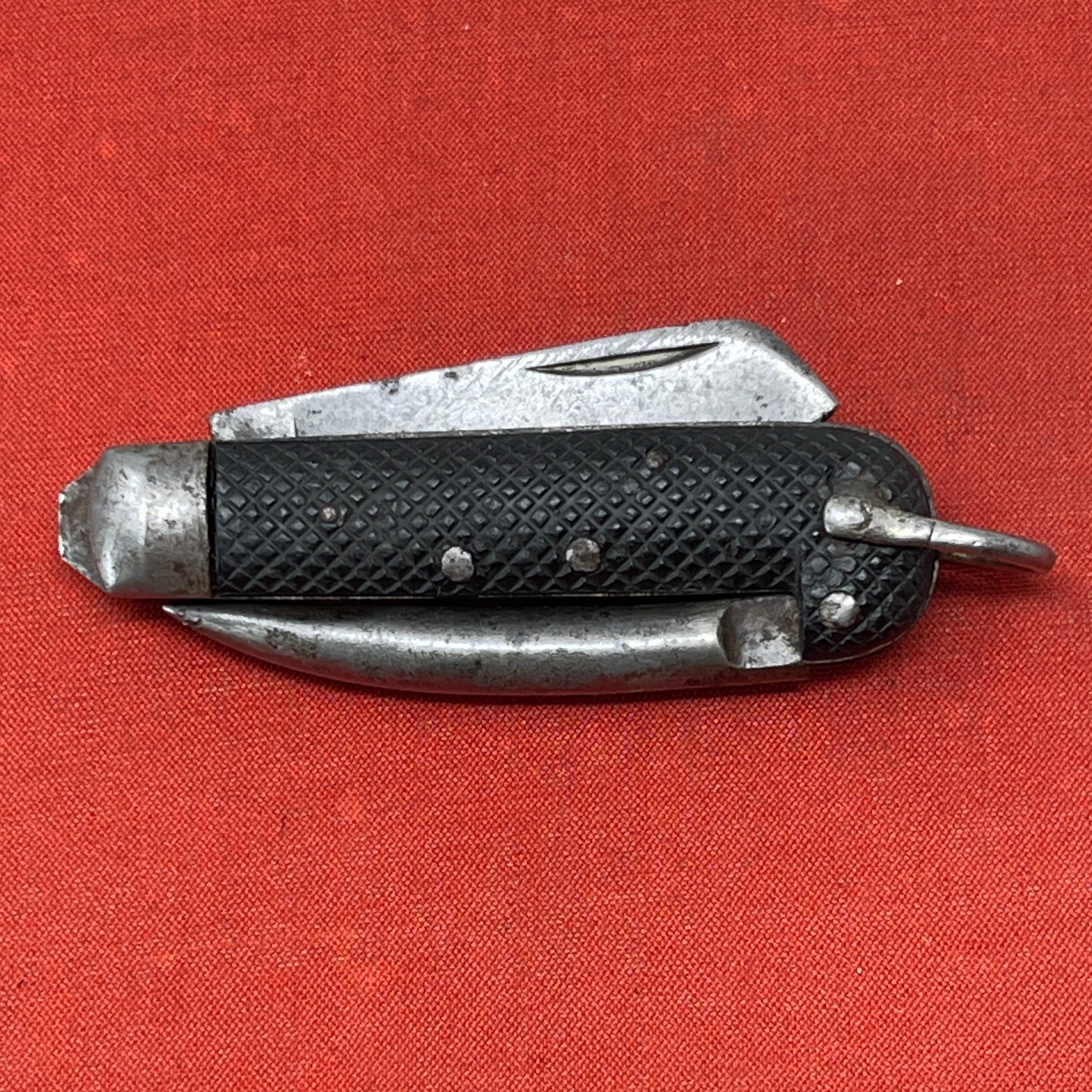 A nice example of a British Jack Knife, Dated 1943 Manufactured in Sheffield by Richards. A genuine antique that is in great condition for its age The blades are in good condition, the chequered Bakelite grip is intact and all the blades lock and close as they should. The steel can opener is in good condition along with the spike. This knife