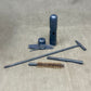Set of gun cleaning tools on a textured surface