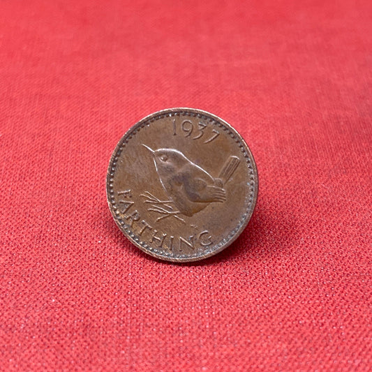 Discover the King George VI Farthing 1940, a historic British coin featuring the iconic wren design. Perfect for collectors and history enthusiasts, this bronze coin reflects the resilience of wartime Britain.