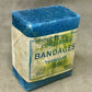 Original 1940 sealed compressed triangular bandage by T. J. Smith & Nephew B.P.C. Wartime medical supply in excellent preserved condition.