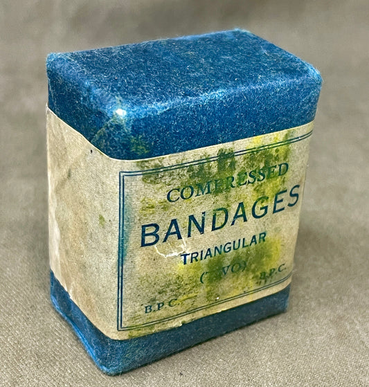 Original 1940 sealed compressed triangular bandage by T. J. Smith & Nephew B.P.C. Wartime medical supply in excellent preserved condition.
