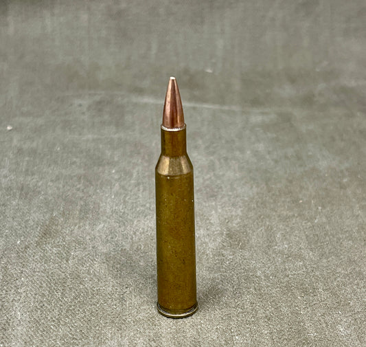 This is an original WW2-era Super .220 Swift round, professionally rendered completely inert for safe collecting and display purposes. The cartridge retains its original full metal jacketed projectile and brass casing, featuring the correct wartime Super headstamp. It has been expertly deactivated, with the primer replaced by an inert one and all propellant removed. The .220 Swift was known for its high velocity and flat trajectory, originally developed in the 1930s and occasionally used for experimental or