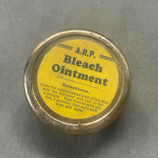 Explore the WW2 1930s British Home Front ARP Bleach Ointment, a rare artifact showcasing civilian preparedness during World War II. Delve into its historical context and preserved contents, offering insight into wartime medical supplies and the resilience of British civilians on the home front.