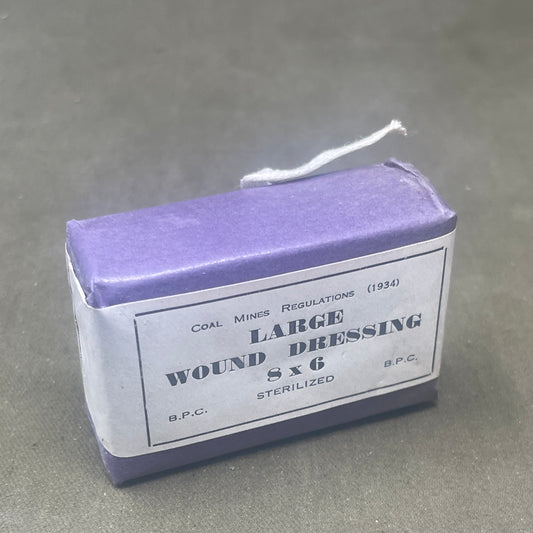 Explore the historical artifact of the WW2 1930s British Home Front ARP Large First Aid Dressing, Mines Type. Delve into its significance in civilian air raid precautions during World War II, showcasing resilience and preparedness amidst wartime challenges.